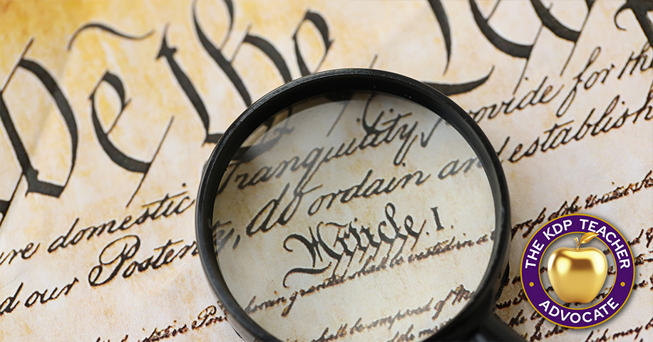 Image of the US Constitution with Magnifying Glass